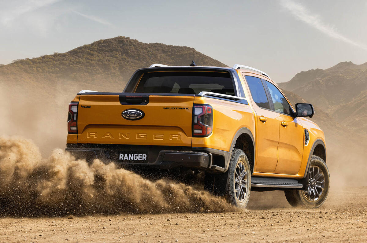2022Ford NextGenRanger Wildtrak Rear3QTR motion sand 2022Ford NextGenRanger Wildtrak Rear3QTR motion sand