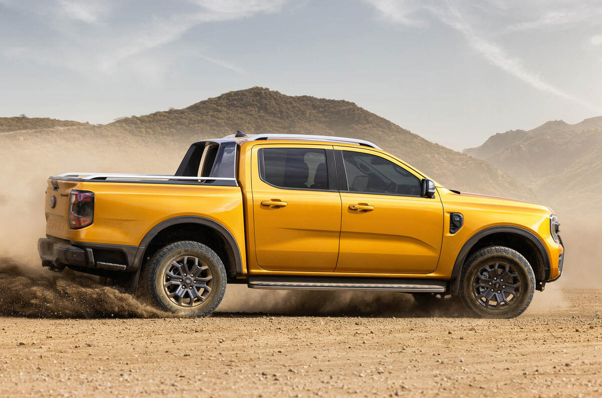 2022Ford NextGenRanger Wildtrak side motion sand 2022Ford NextGenRanger Wildtrak side motion sand
