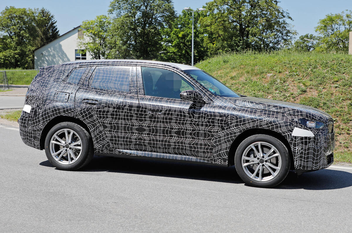 2024 BMW X3 side driving 2024 BMW X3 side driving