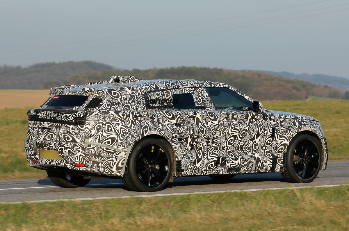 2026 Range Rover Velar EV testing camo rear quarter tracking 2026 Range Rover Velar EV testing camo rear quarter tracking