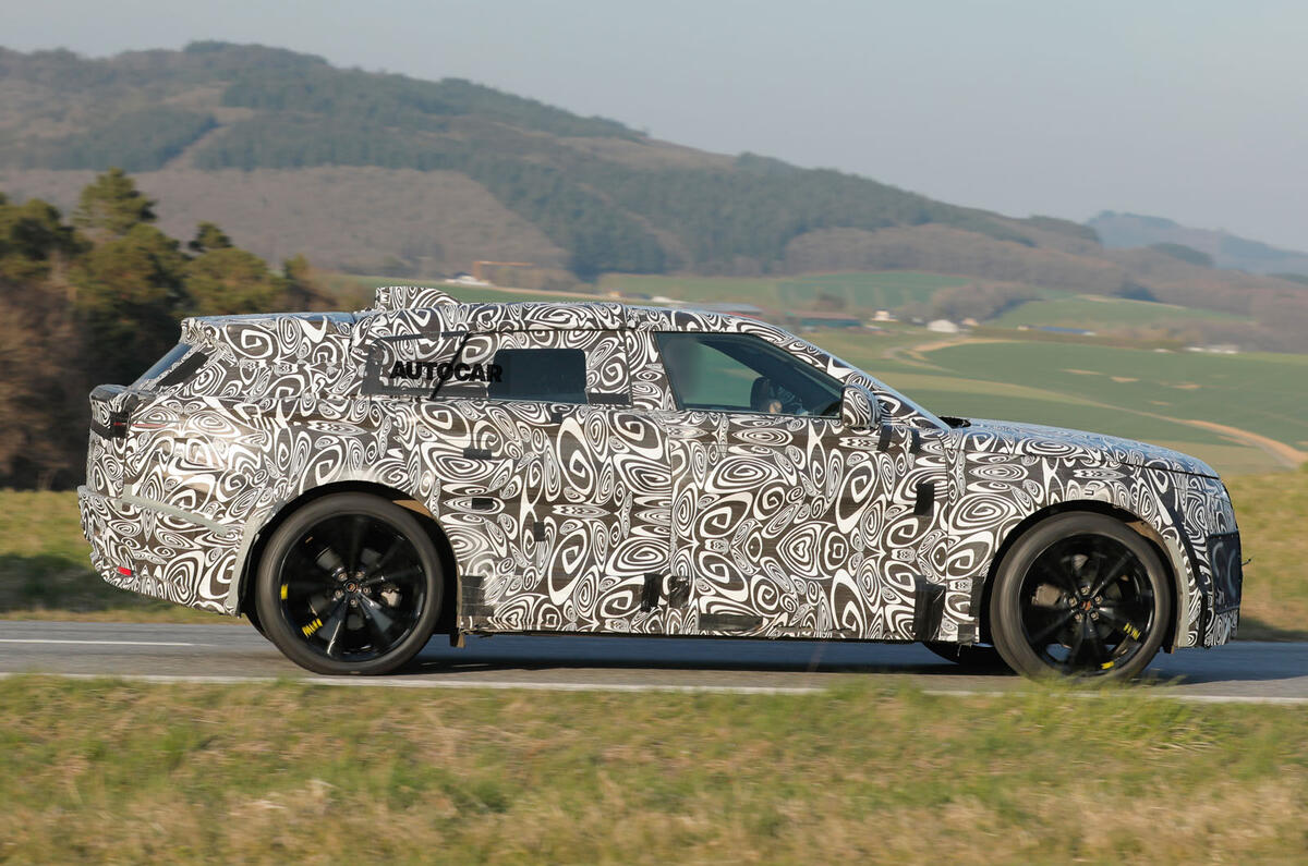 2026 Range Rover Velar EV testing camo side tracking 2026 Range Rover Velar EV testing camo side tracking
