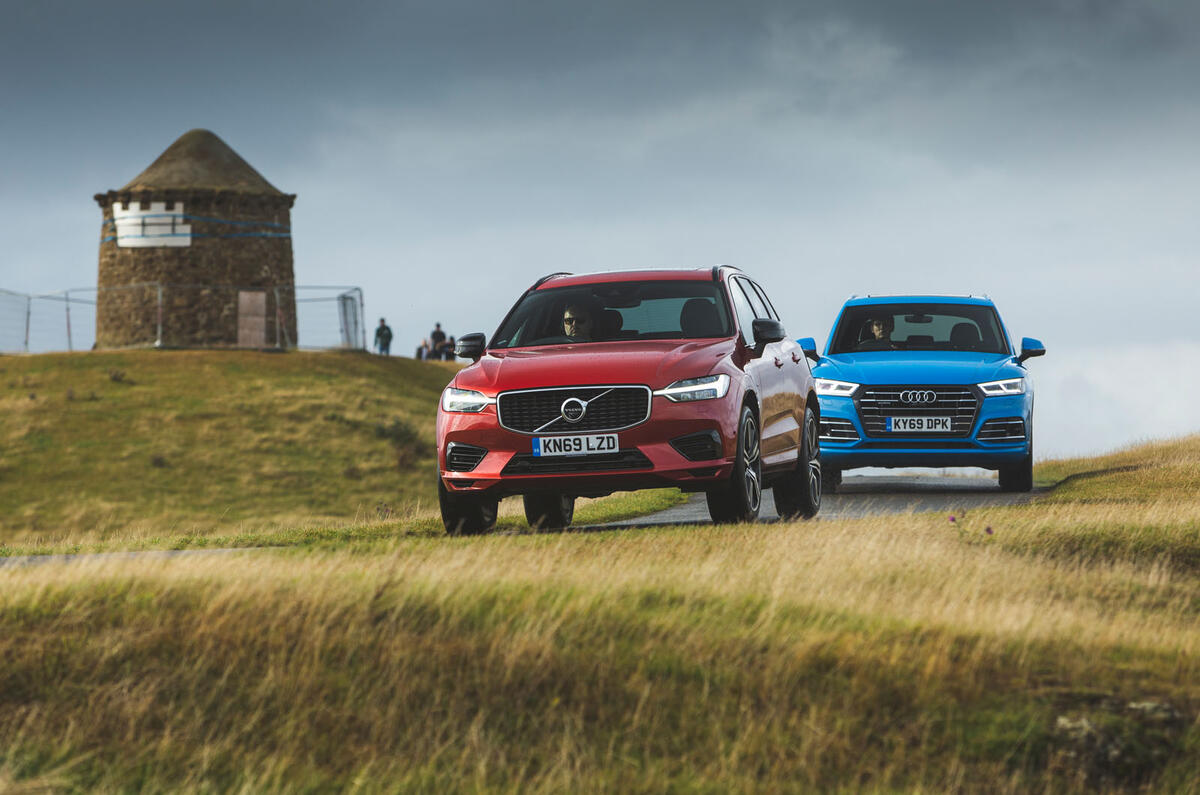 Volvo leading Audi from front Volvo leading Audi from front