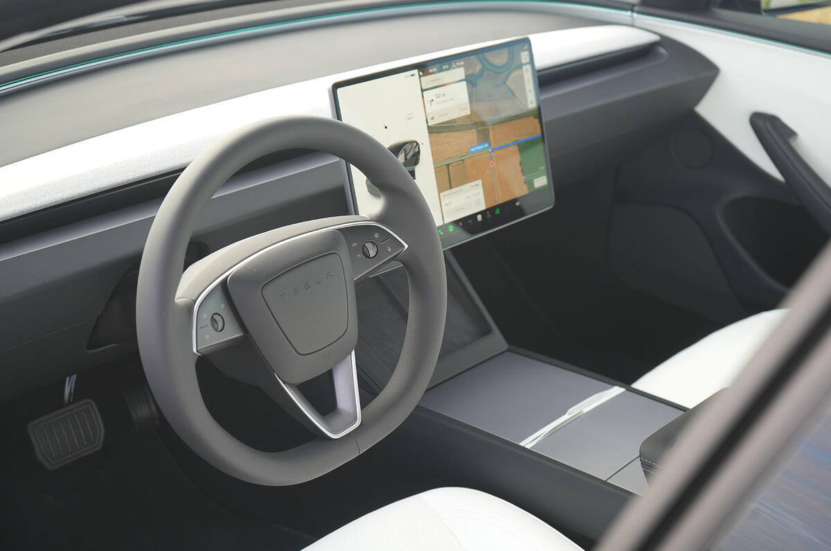 7 tesla model 3 facelift review 2023 13 steering wheel 7 tesla model 3 facelift review 2023 13 steering wheel