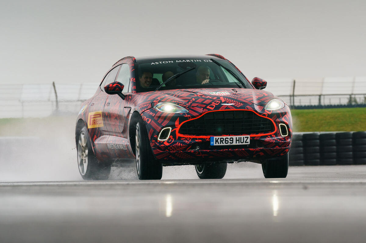 2020 Aston Martin DBX camouflaged prototype ride - oppo