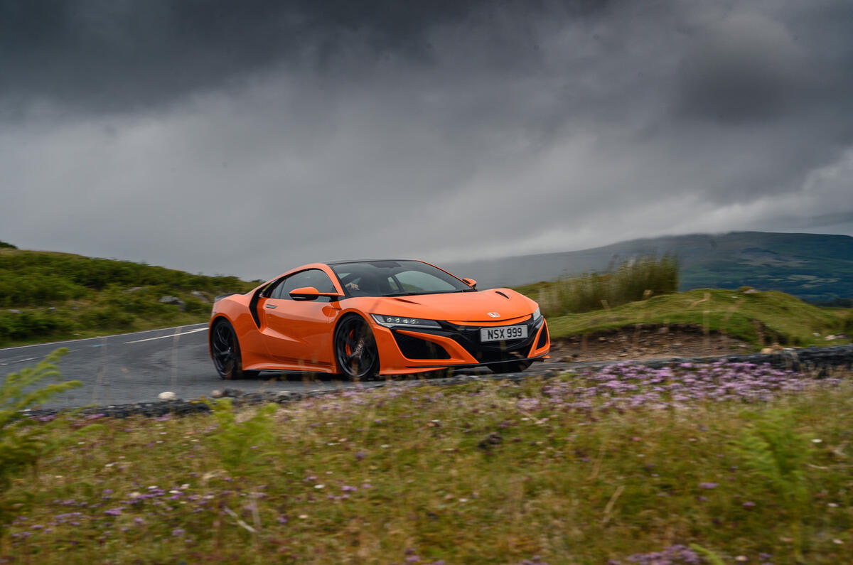 Honda NSX hybrid supercar feature - cornering left Honda NSX hybrid supercar feature - cornering left