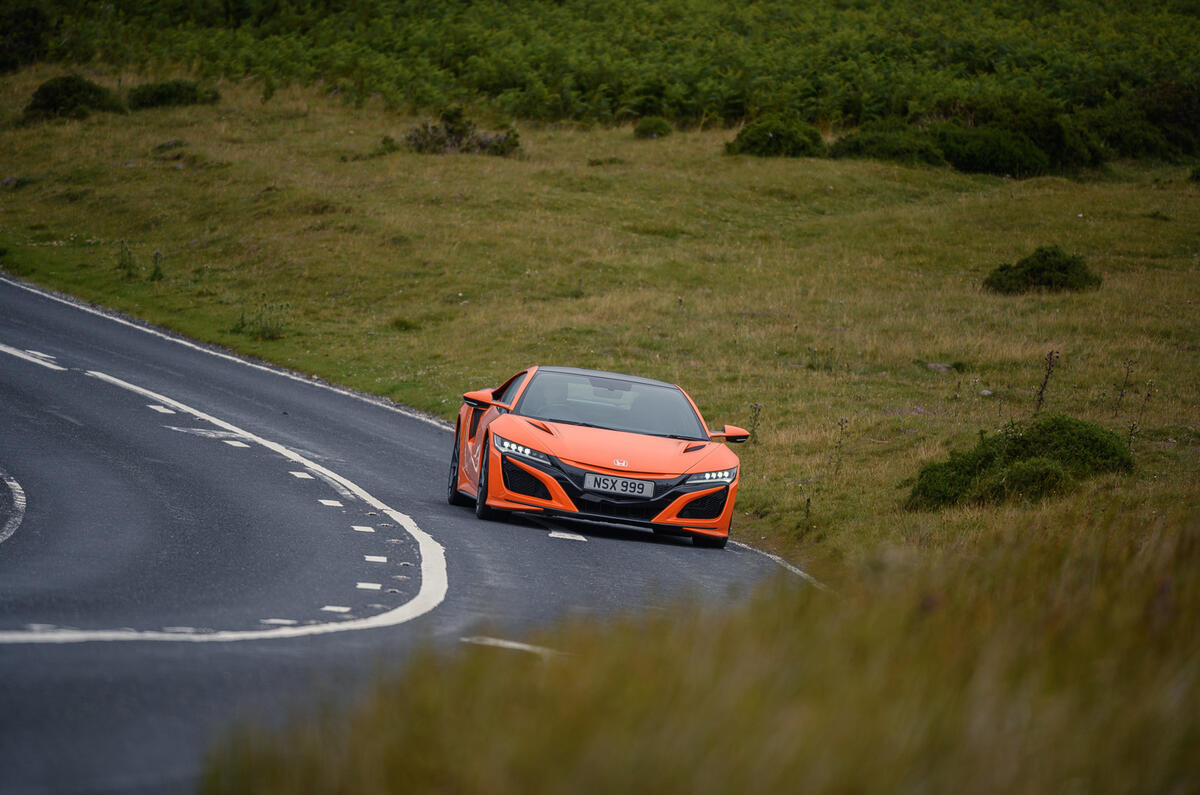 Honda NSX hybrid supercar feature - cornering right Honda NSX hybrid supercar feature - cornering right