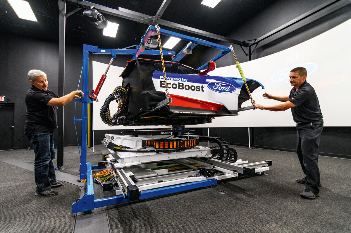 Technicians working on simulator Technicians working on simulator