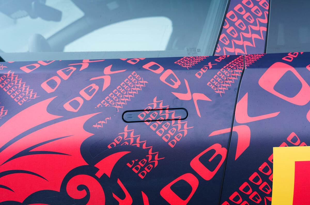 2020 Aston Martin DBX camouflaged prototype ride - door handles