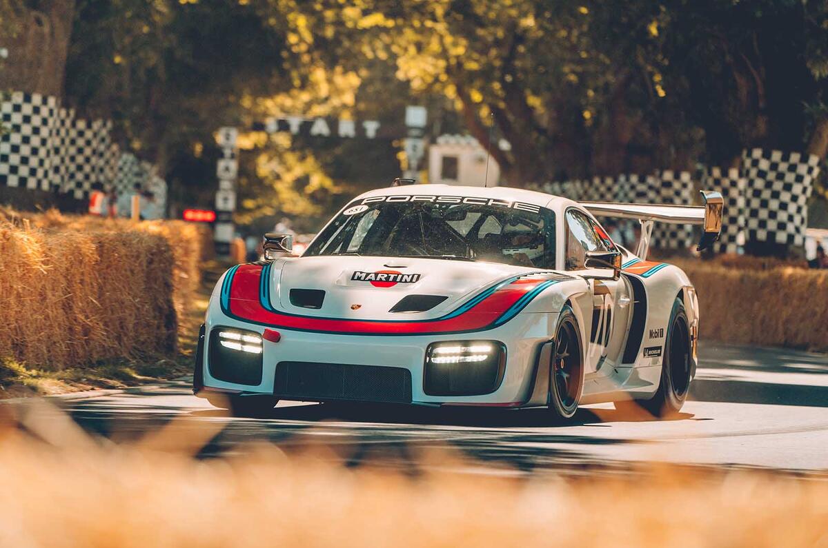 Porsche 936 going up Goodwood hill