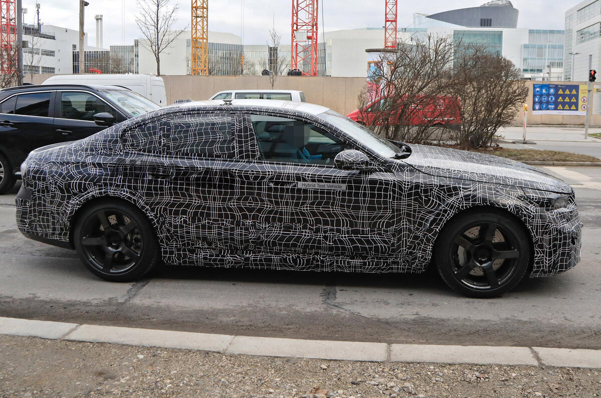 96 2024 BMW M5 hybrid spy images side 96 2024 BMW M5 hybrid spy images side