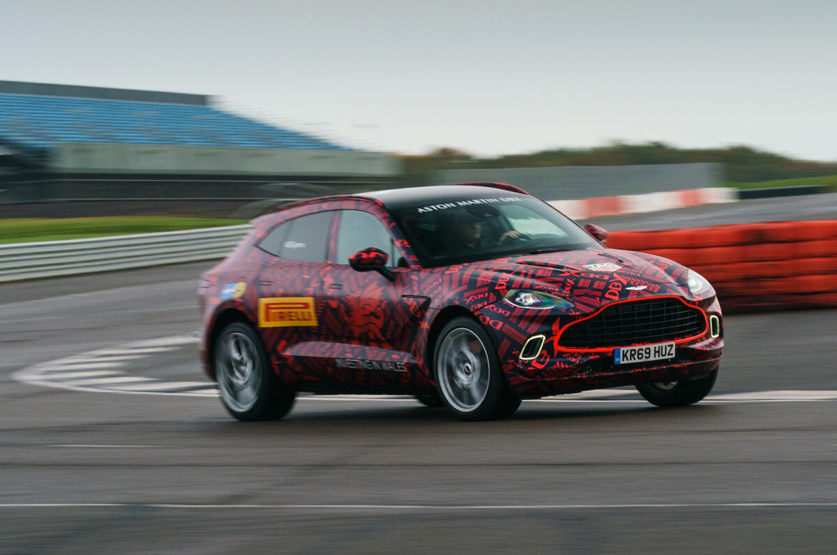 2020 Aston Martin DBX camouflaged prototype ride - cornering front