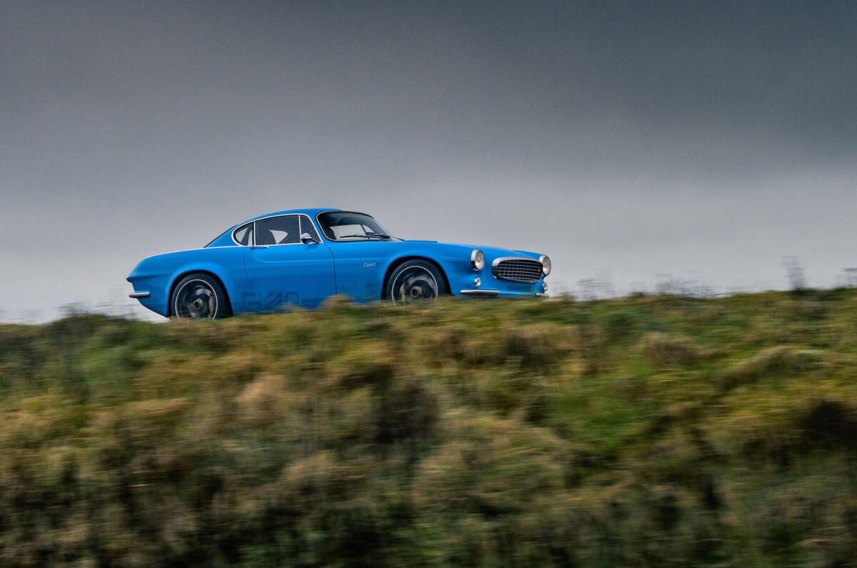 Cyan Volvo P1800 drive - hero side