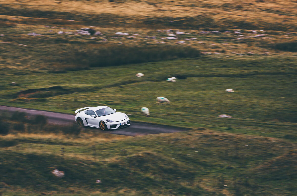 Porsche 718 Cayman GT4 driving - front side