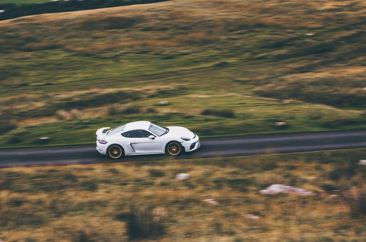 Porsche 718 Cayman GT4 driving - side