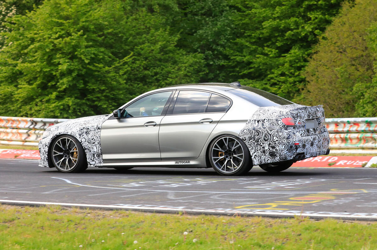 2021 BMW M5 CS prototype at Nurburgring - cornering side 2021 BMW M5 CS prototype at Nurburgring - cornering side