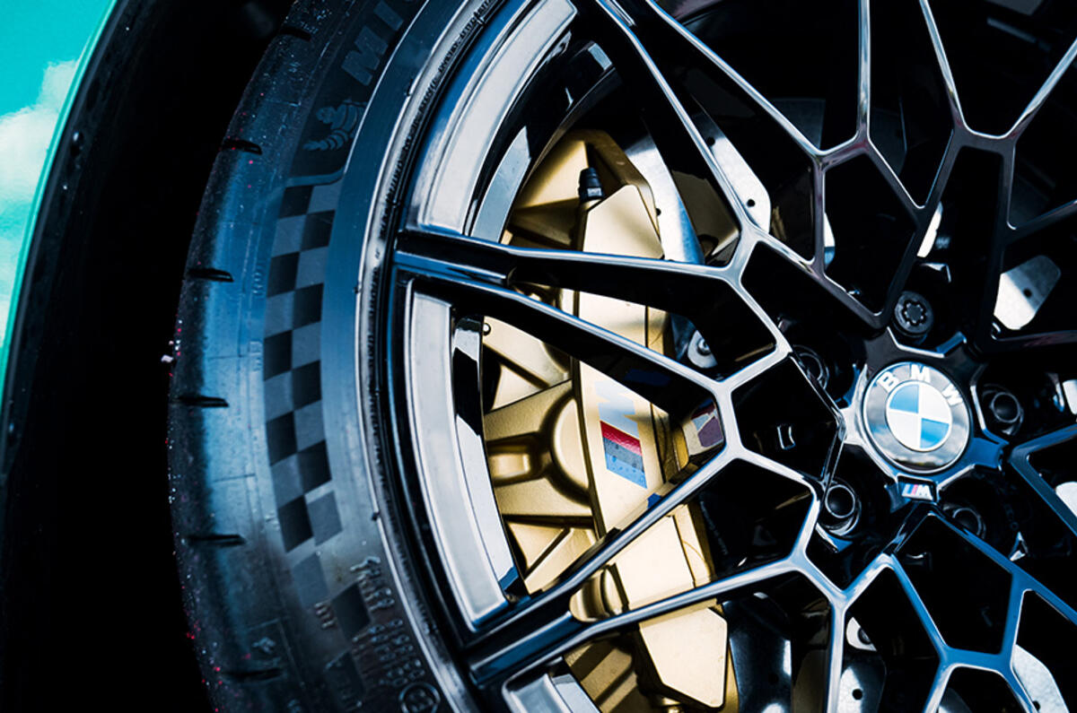 BMW M Compound six-piston fixed-caliper brakes deliver impressive stopping power