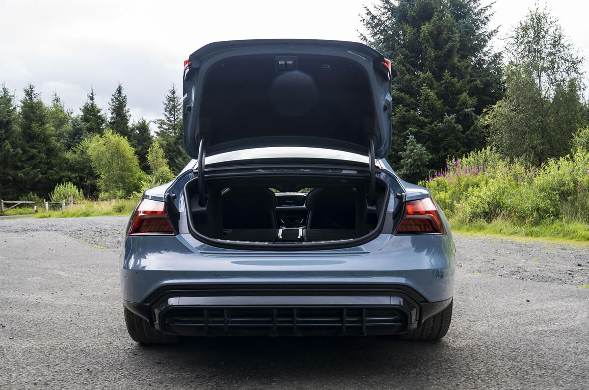 #8 The Audi e-tron GT quattro’s 40:20:40 folding rear seat was a real boon, letting us slide in long items  #8 The Audi e-tron GT quattro’s 40:20:40 folding rear seat was a real boon, letting us slide in long items