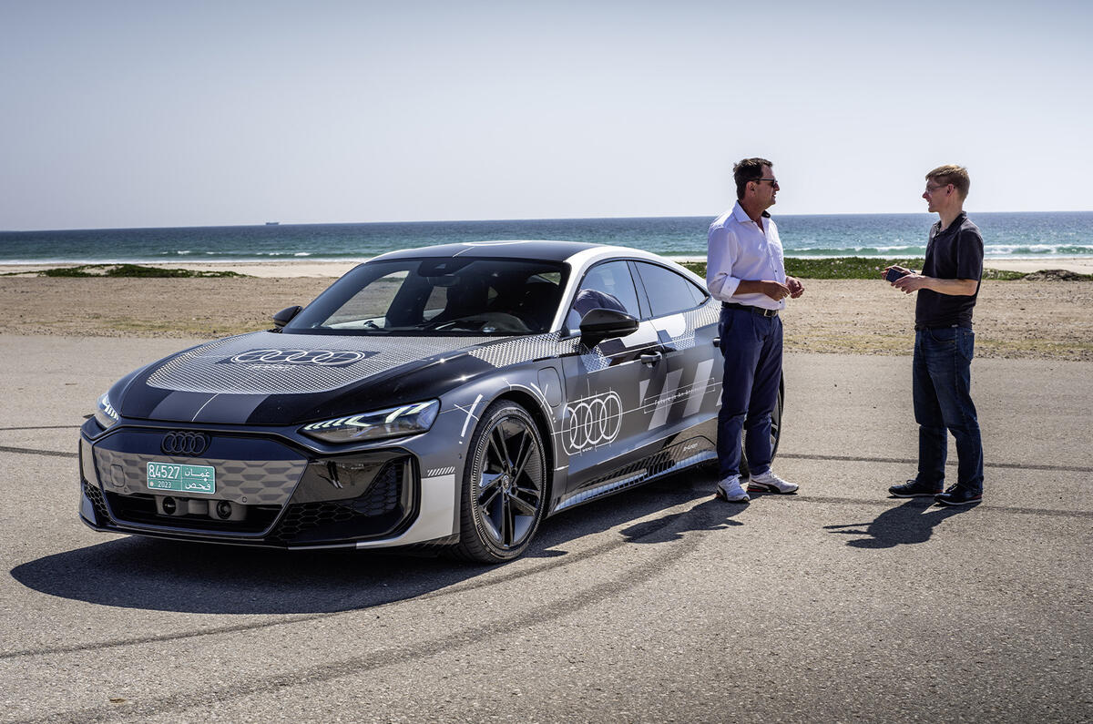 Audi RS E tron GT parked with peolpe Audi RS E tron GT parked with peolpe