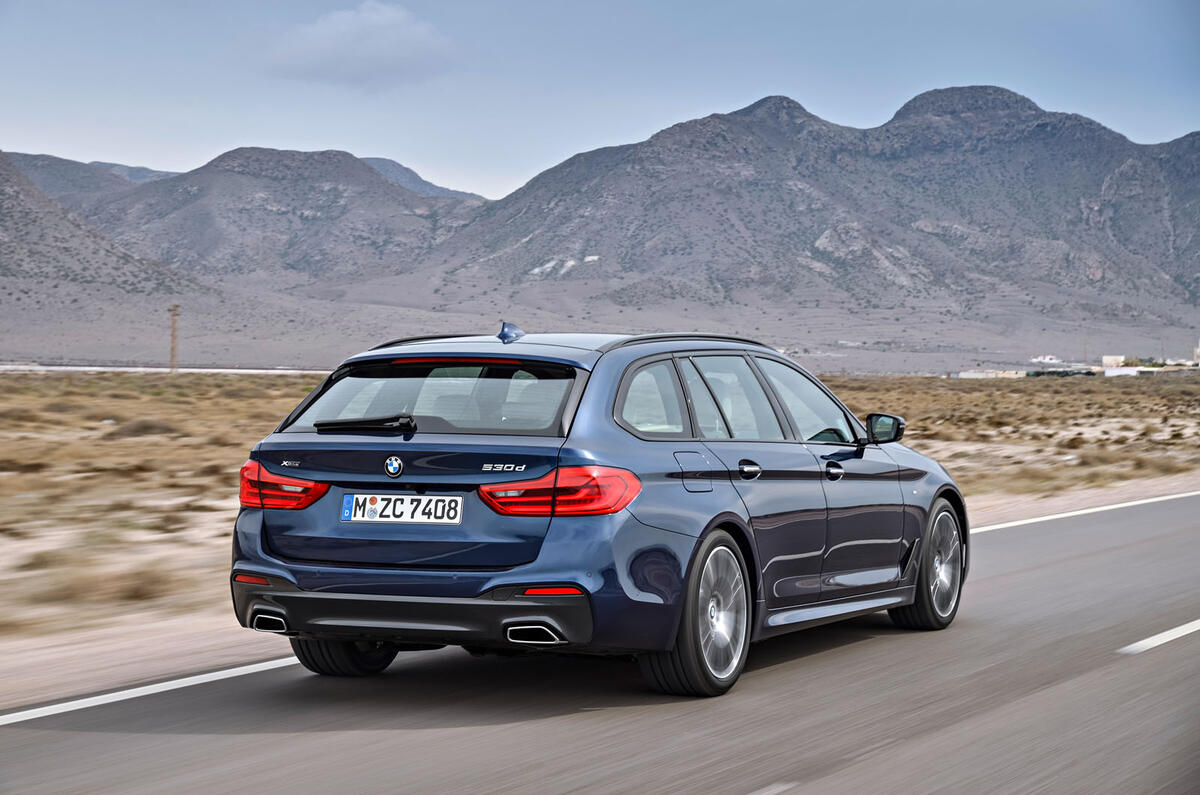 2017 BMW 5 Series Touring in front of mountains