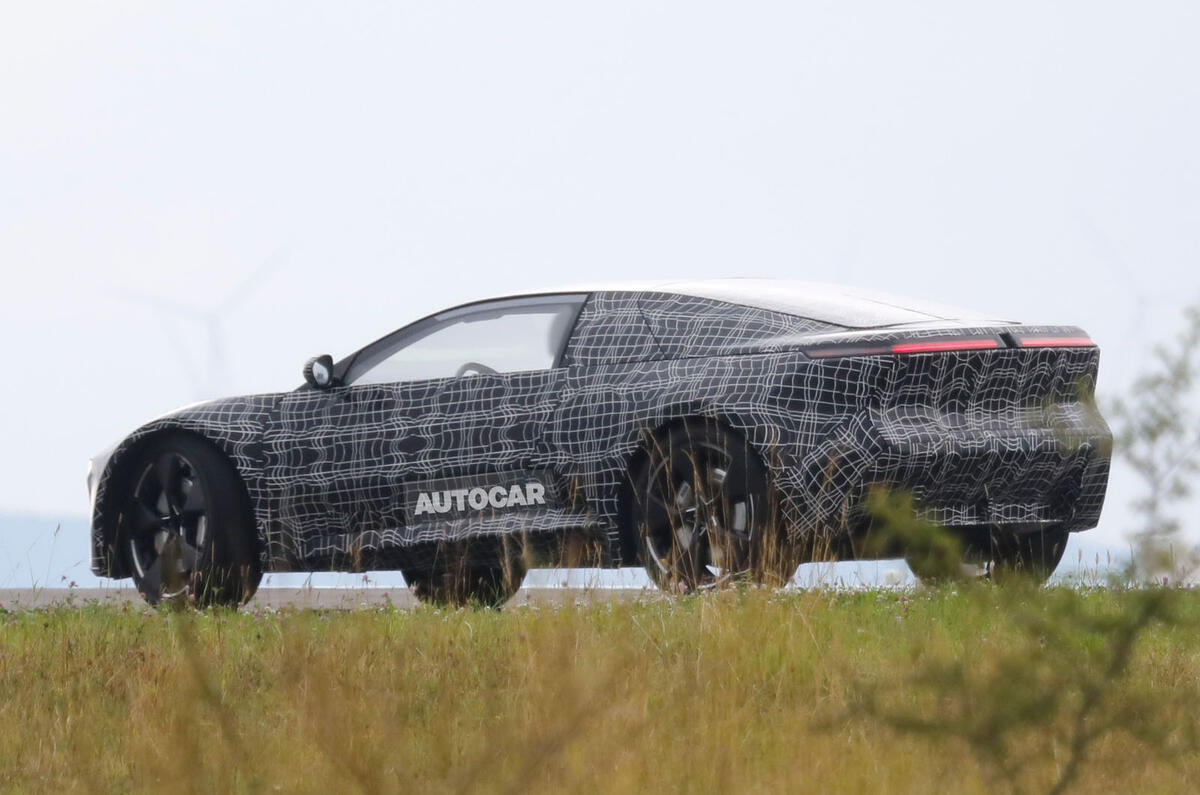 BMW Neue Klasse coupe camouflaged rear quarter cornering BMW Neue Klasse coupe camouflaged rear quarter cornering