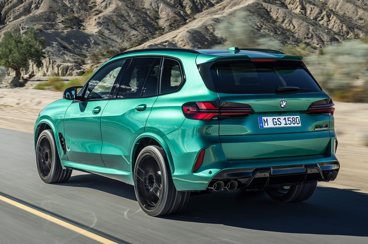 BMW X5M driving rear BMW X5M driving rear