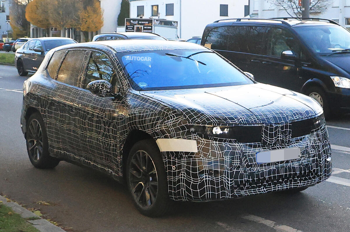 BMW Neue Klasse SUV in traffic BMW Neue Klasse SUV in traffic