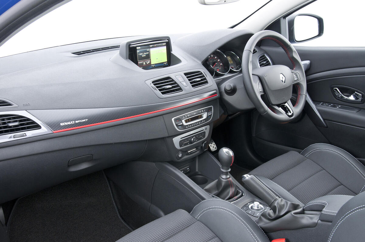 The GT 220 interior features sports seats and a leather-rimmed steering wheel
