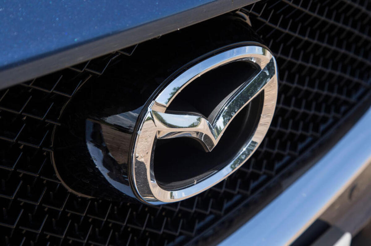 Mazda badge Mazda badge