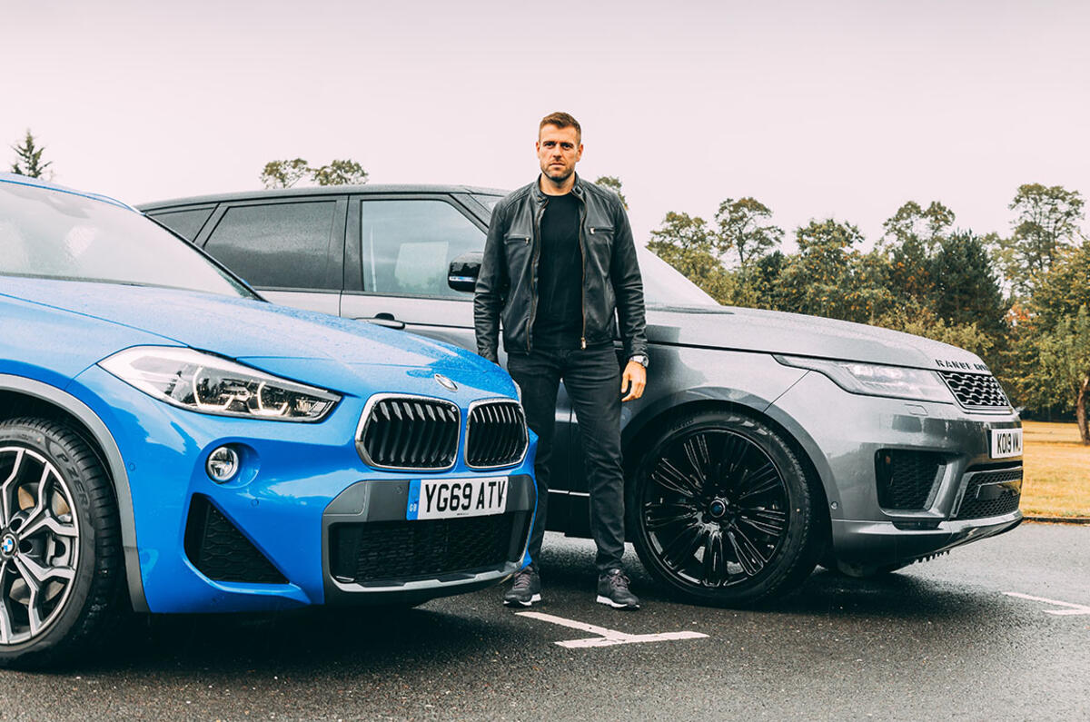 Wright in front of Land Rover