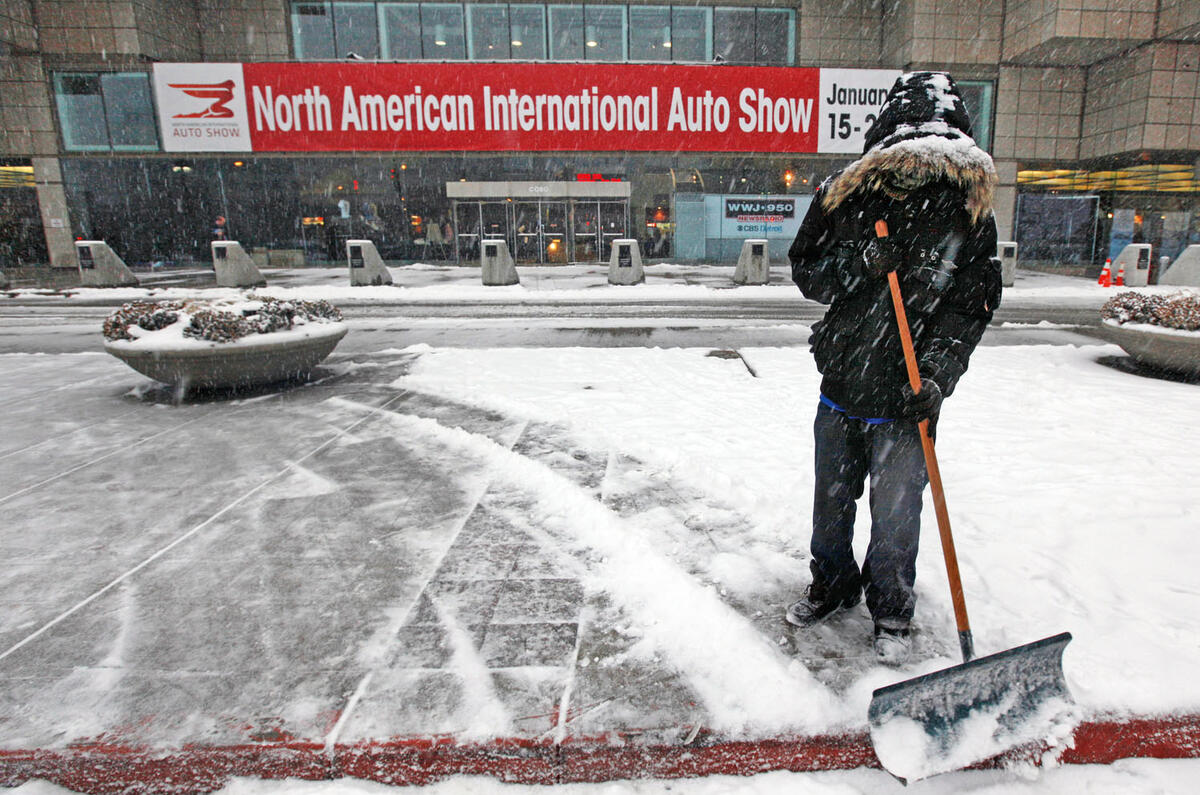 Detroit motor show - shovelling snow