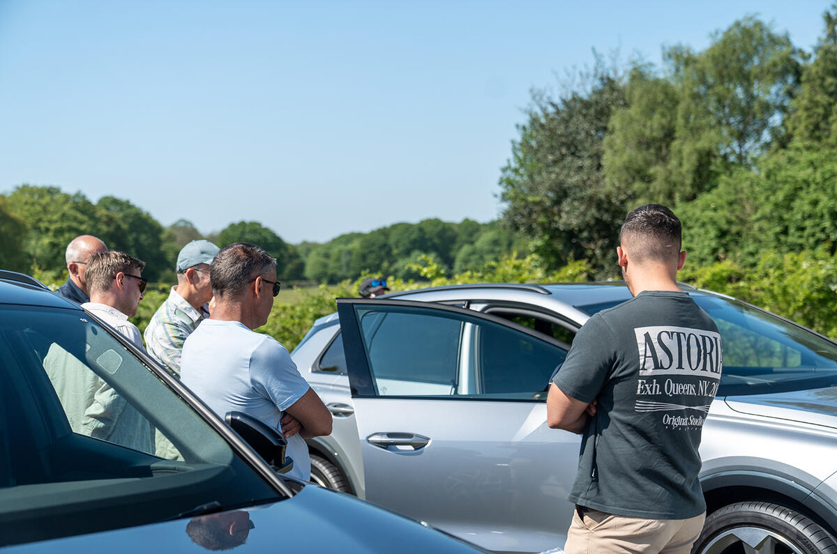 People looking at cars