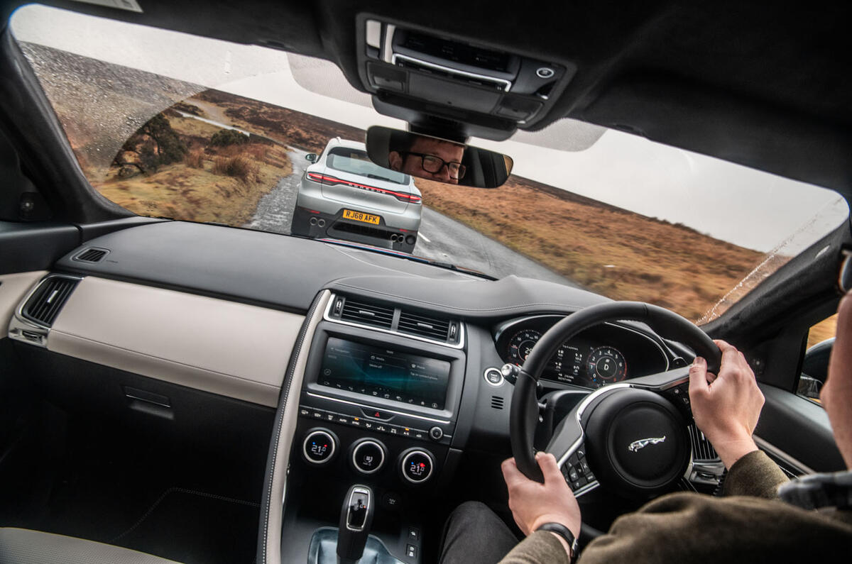 Porsche Macan vs Jaguar E-Pace 2019 - Jaguar driving inside cabin