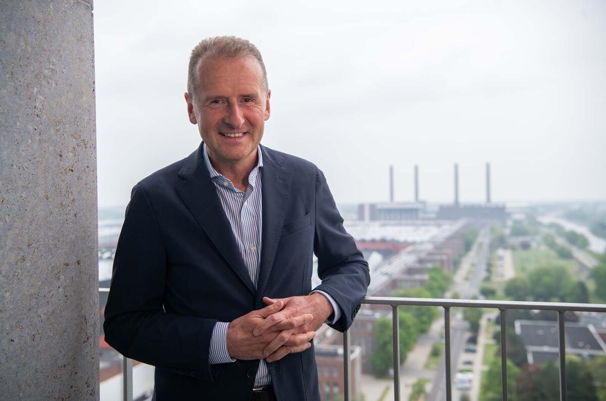 Volkswagen boss Herbert Diess talks to Autocar