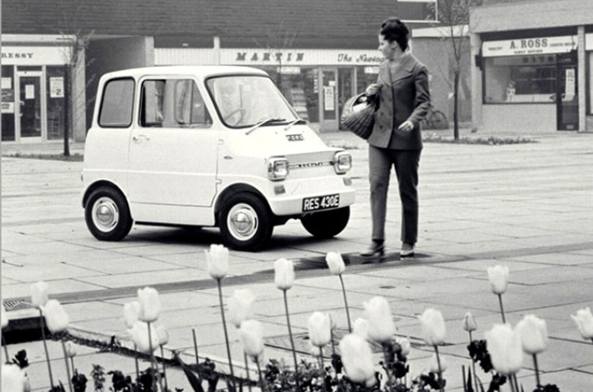 Woman next to a Ford Comuta
