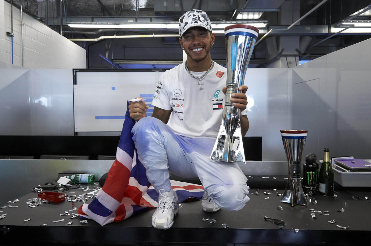 Lewis Hamilton celebrates his sixth world title