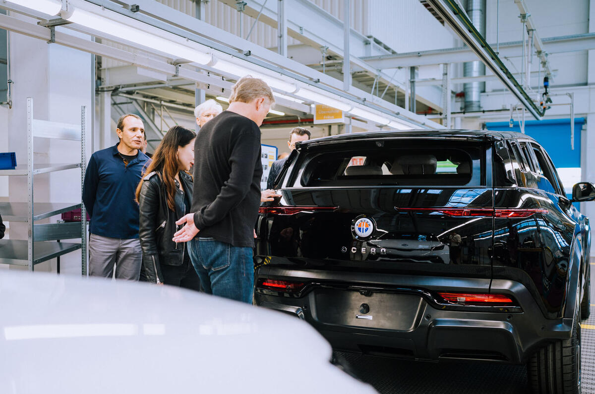 Henrik Fisker inspecting black Fisker Ocean