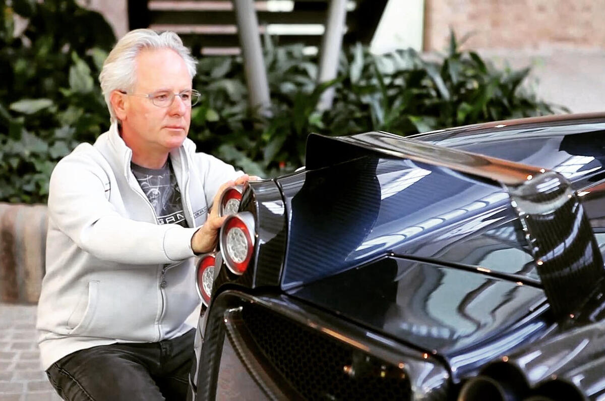 Horacio Pagani admiring Huayra rear