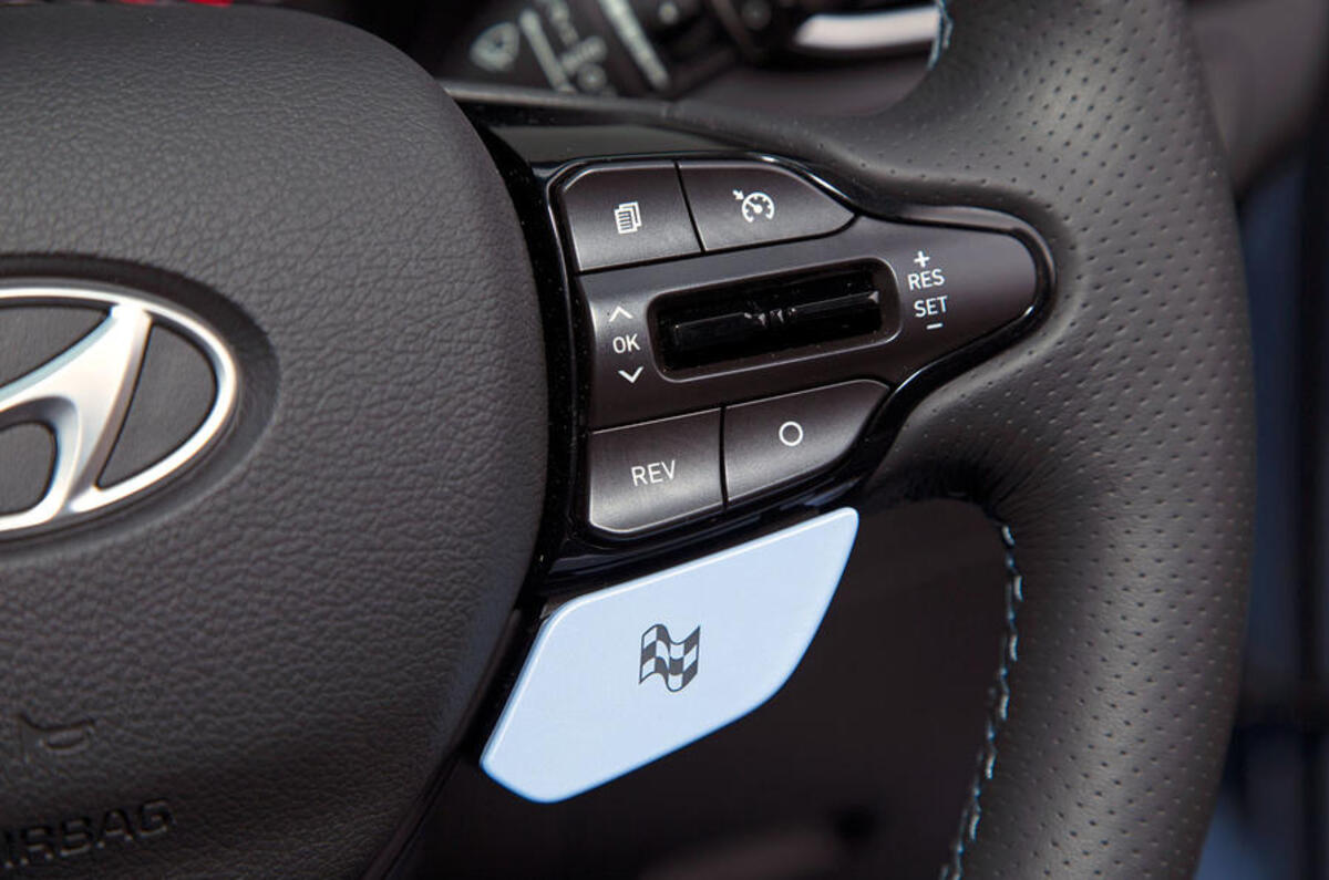 Volkswagen Golf GTI vs Hyundai i30n hyundai steering wheel drive mode button