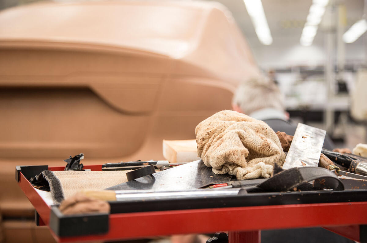 Clay modellers shape a secret car