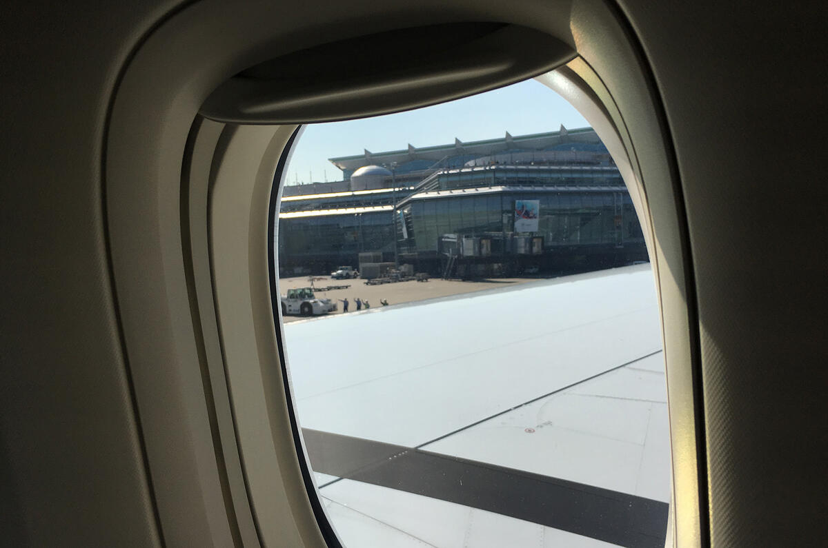 Ground crew waving plane goodbye Tokyo airport
