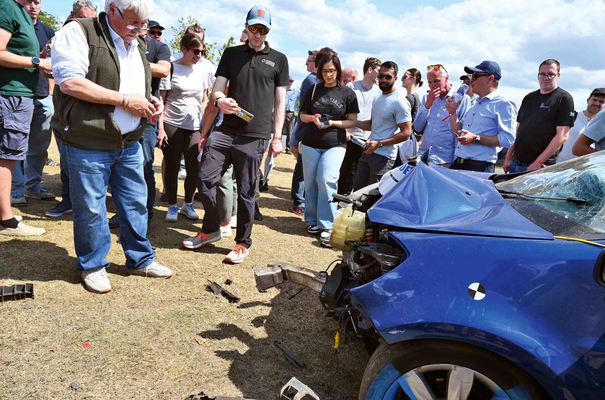 Inspecting damaged Clio Inspecting damaged Clio