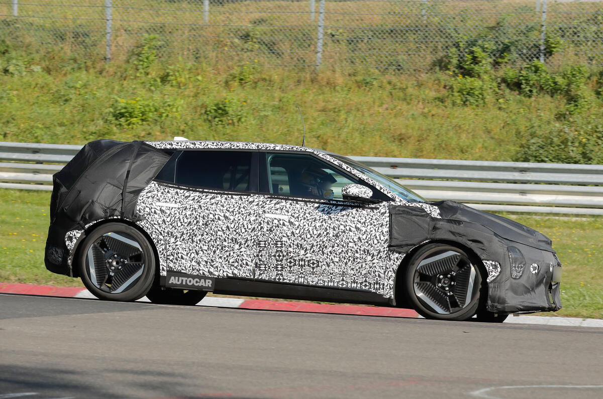 Kia EV4 hatch camo side