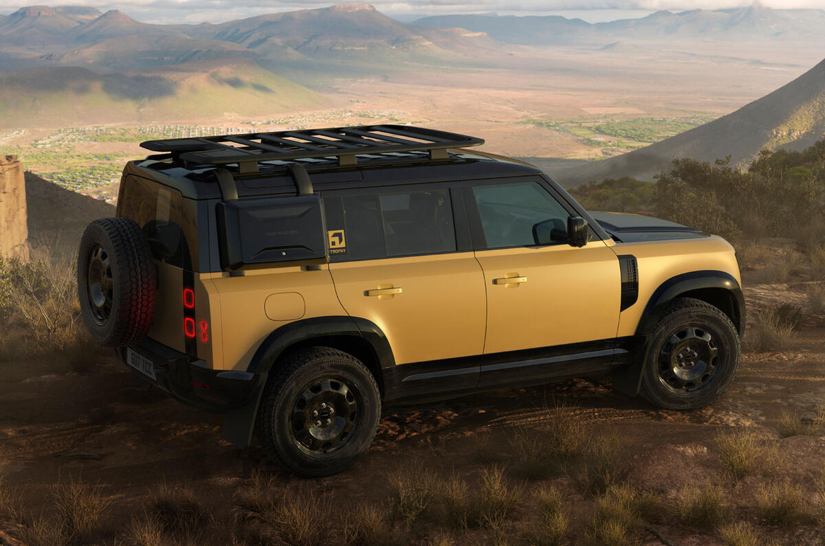 Land Rover Defender Trophy Edition yellow rear quarter static high Land Rover Defender Trophy Edition yellow rear quarter static high