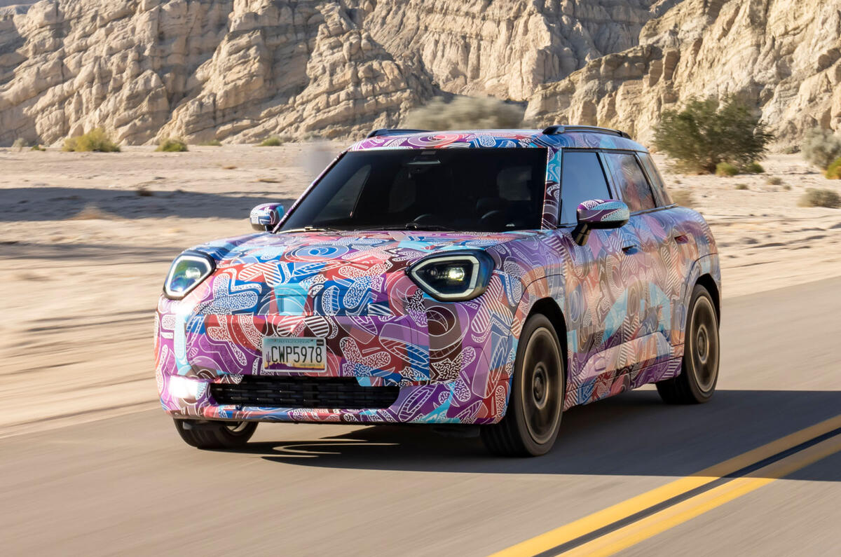 Mini Aceman camouflaged front quarter driving Mini Aceman camouflaged front quarter driving