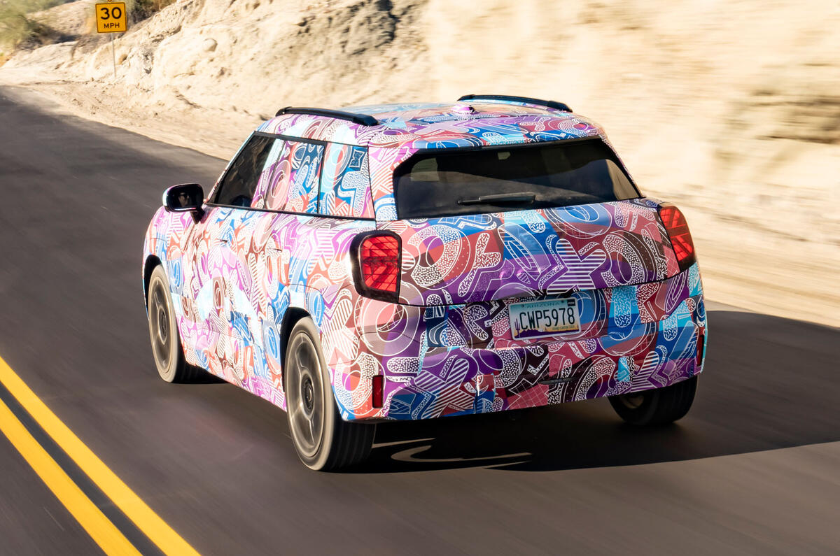 Mini Aceman camouflaged rear quarter driving Mini Aceman camouflaged rear quarter driving