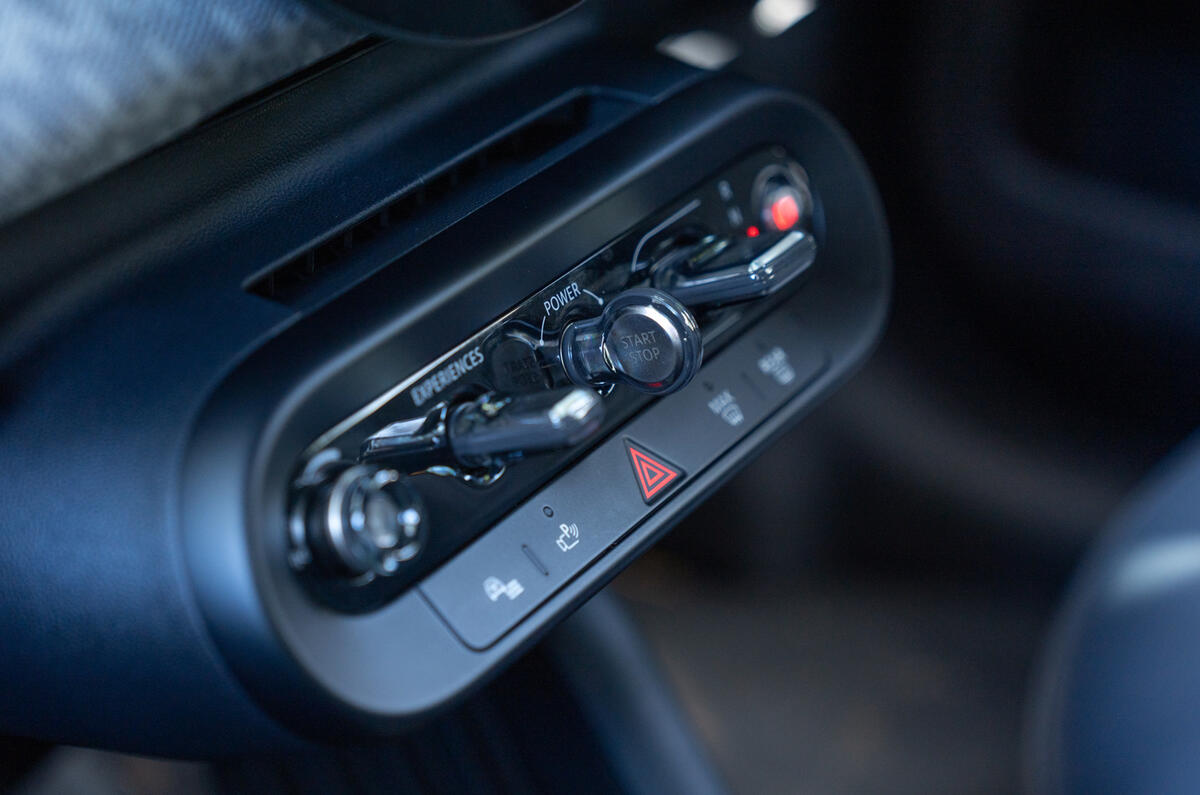 The all-electric MINI Cooper toggles bar The all-electric MINI Cooper toggles bar