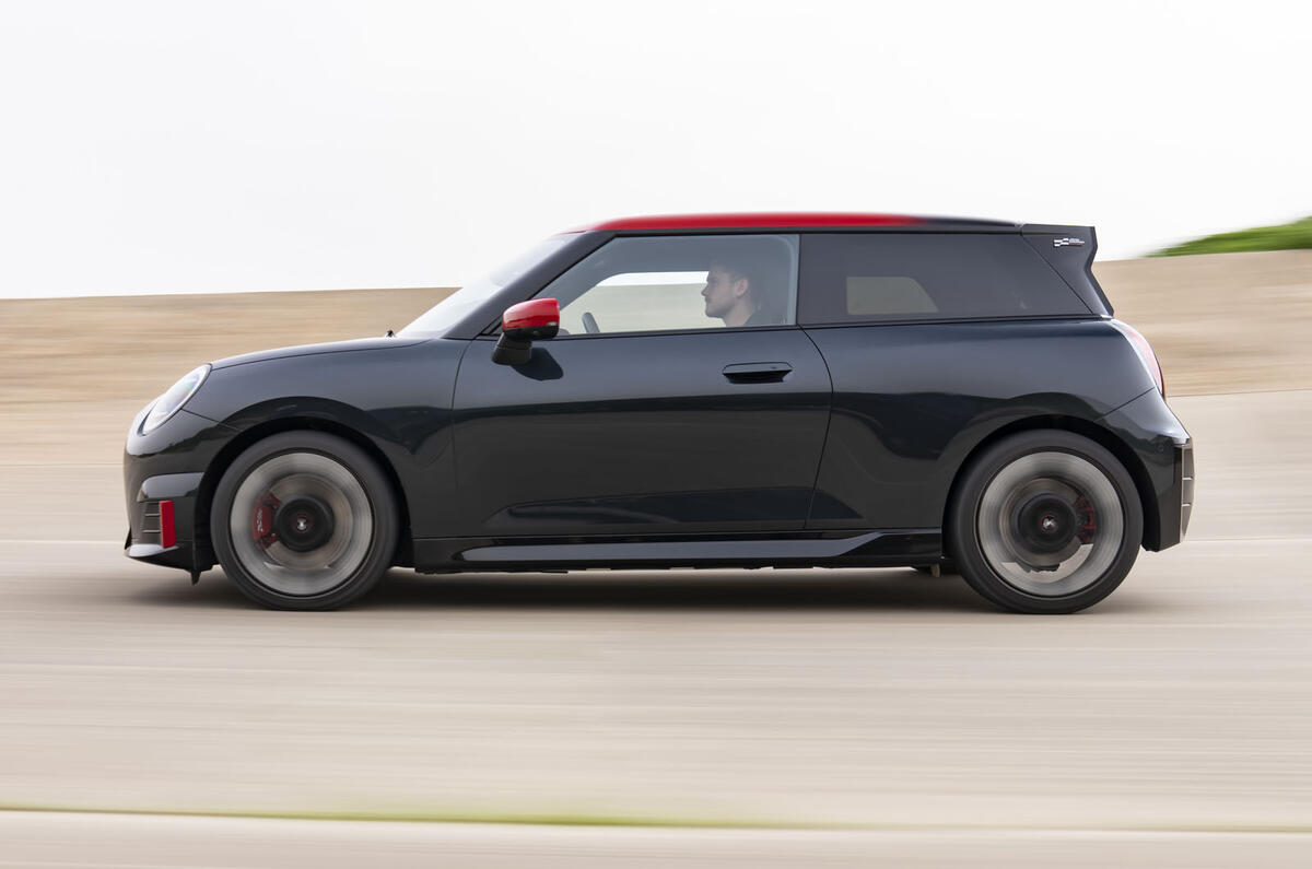 Mini Cooper Electric John Cooper Works   side tracking Mini Cooper Electric John Cooper Works   side tracking
