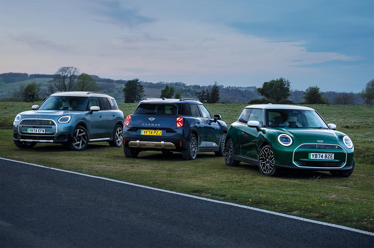 All-electric MINI range, inluding the Cooper, Aceman and Countryman, pictured in front of a scenic countryside backfrop 