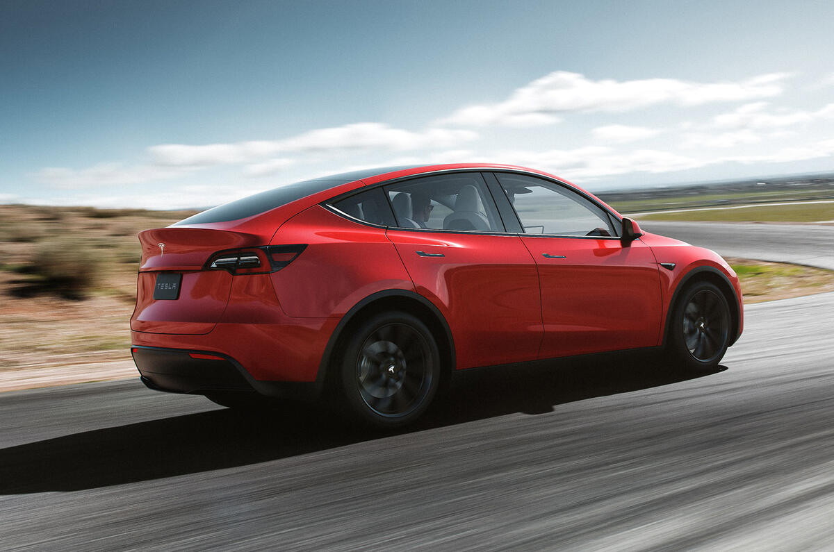 Tesla Model Y on the road red