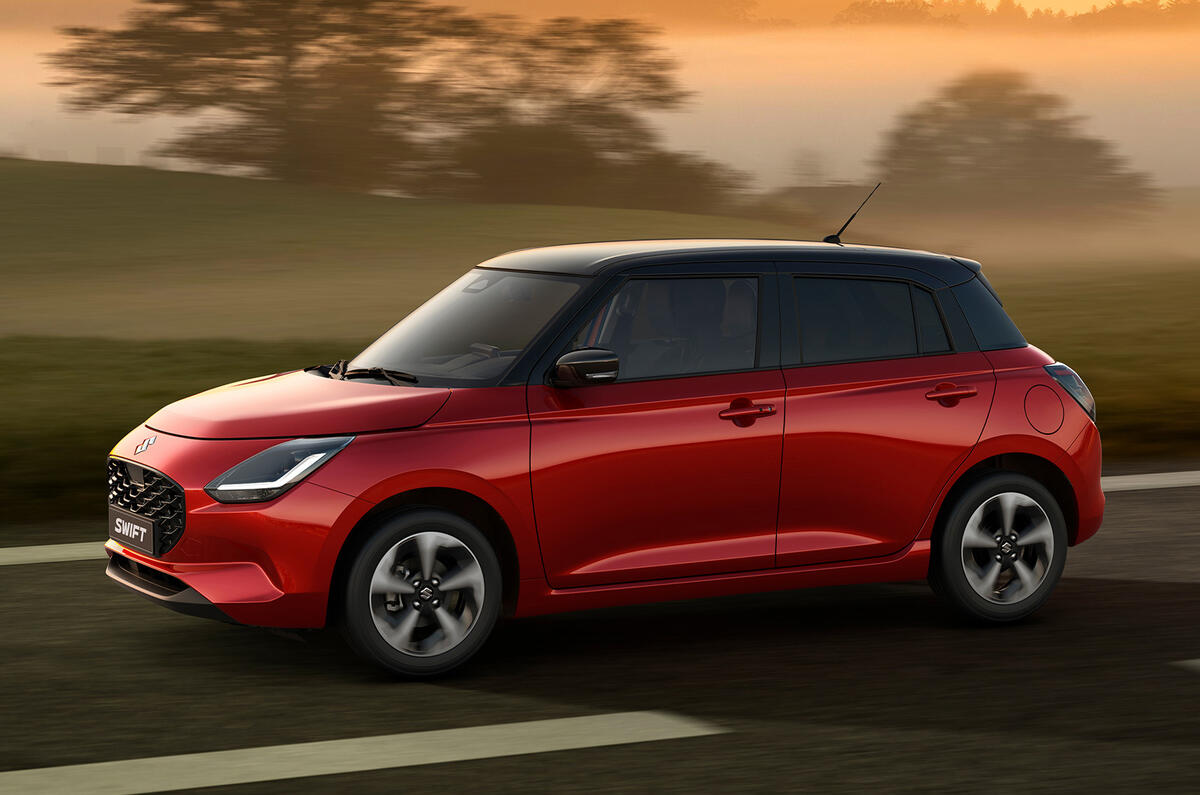 New Suzuki Swift red driving New Suzuki Swift red driving